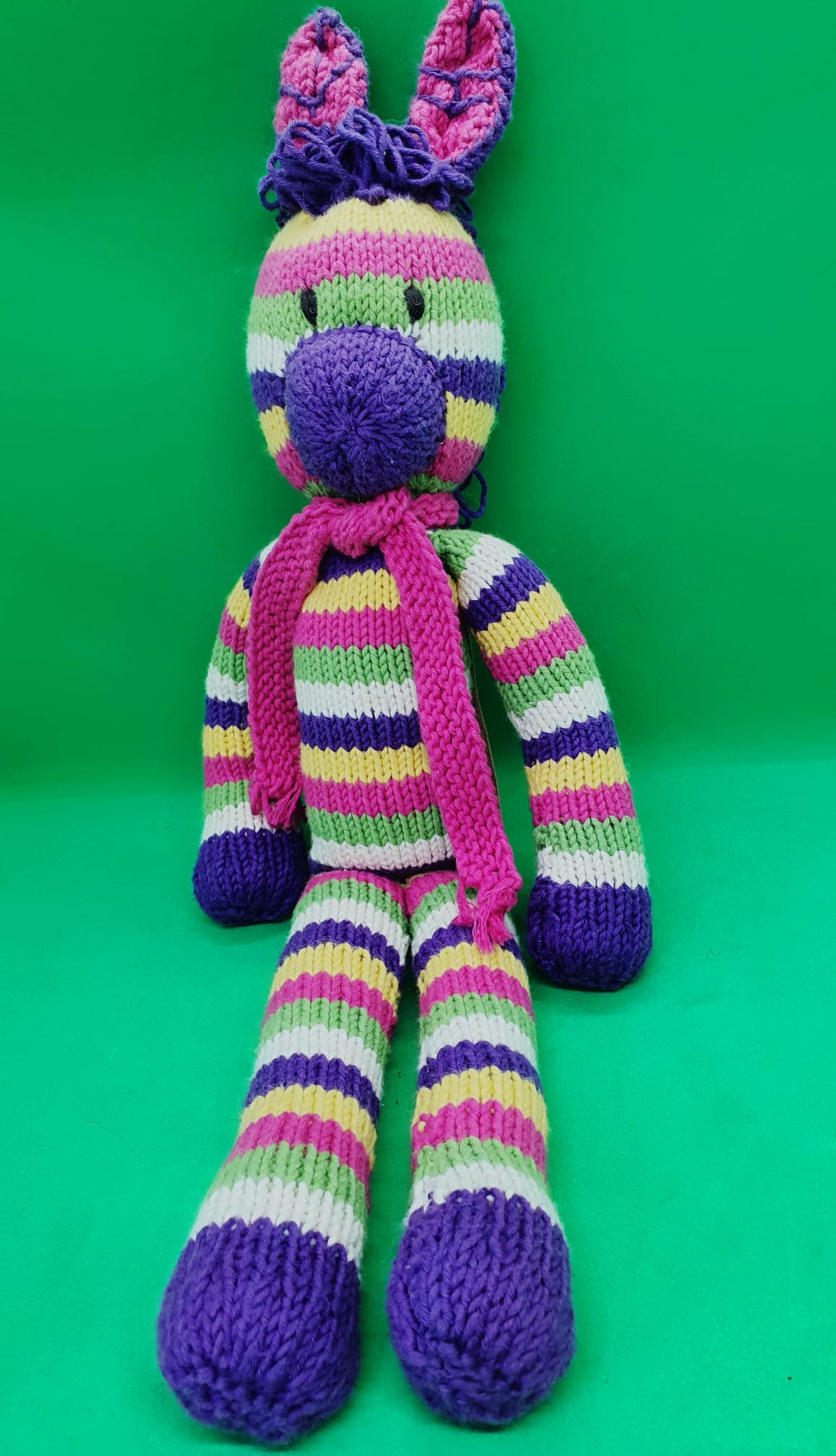 Kenana Knitters, Rainbow Zebra with Pink Scarf