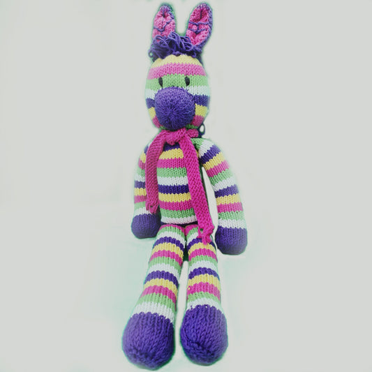 Kenana Knitters, Rainbow Zebra with Pink Scarf